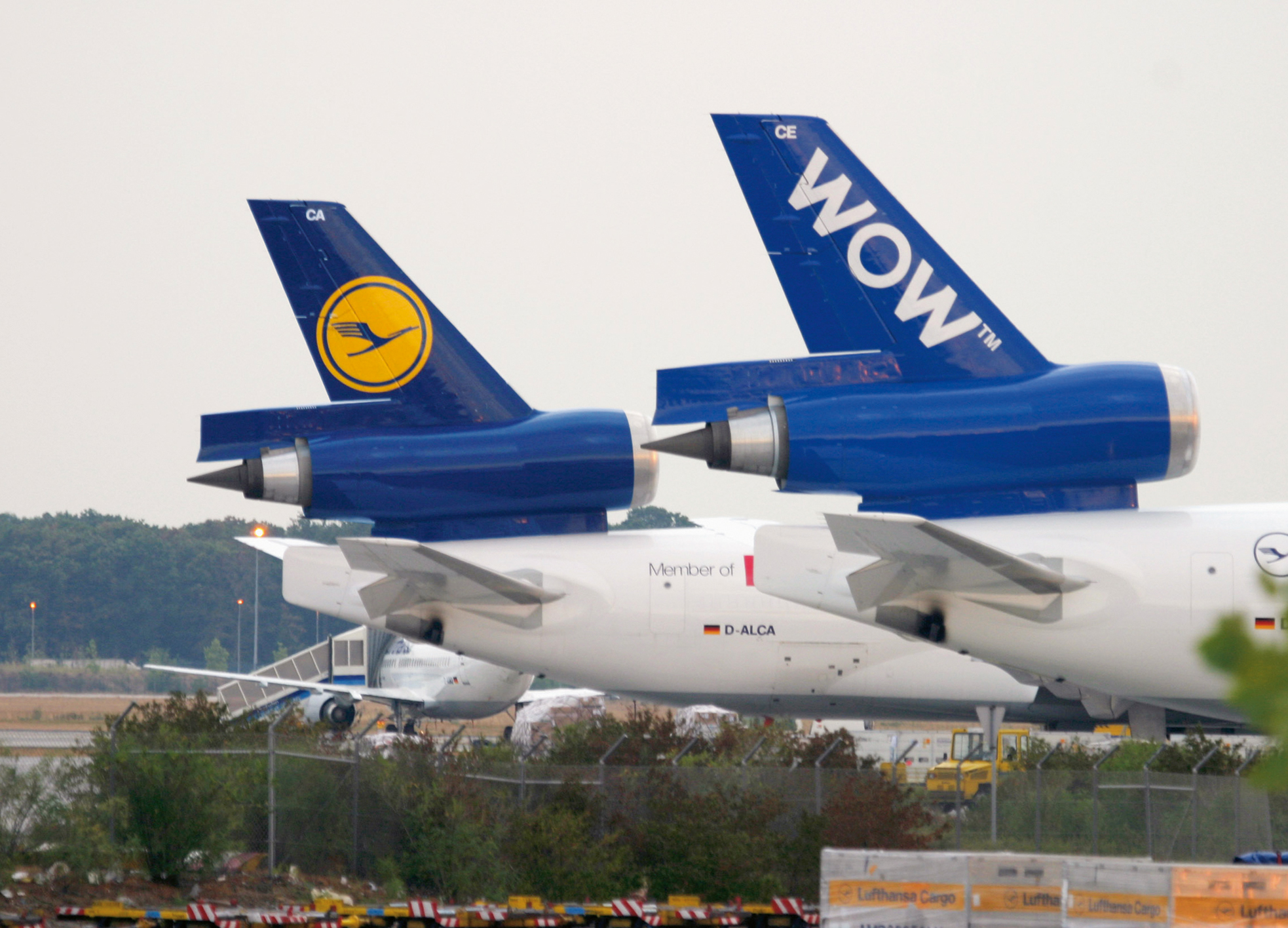 Two MD-11Fs operated by Lufthansa Cargo:  One aircraft features the livery of the cargo  alliance WOW.