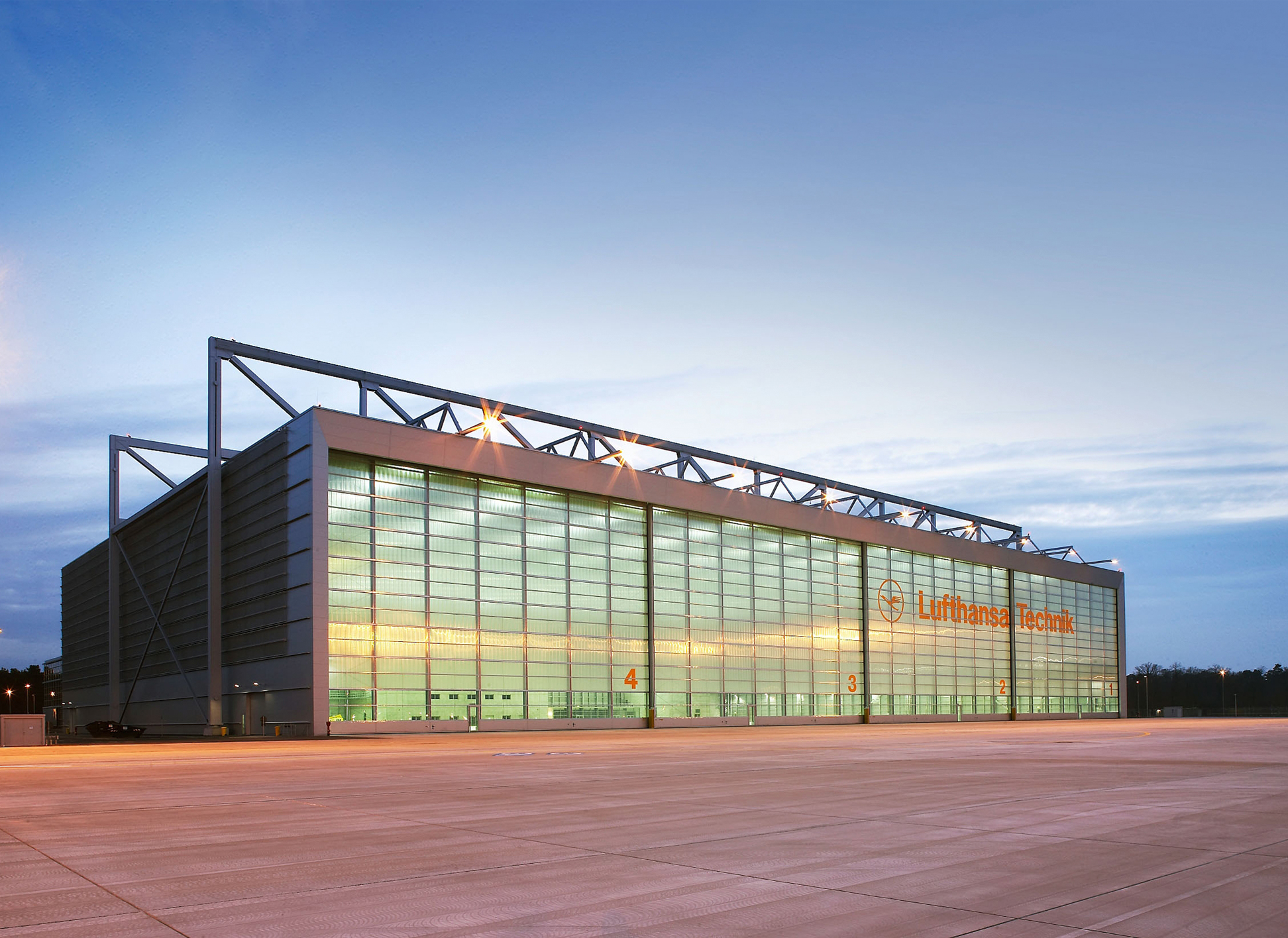 The first section of the new A380 maintenance hangar is inaugurated. With a floor area of some 25,000 square meters, the hangar is large enough for maintenance work to be performed on two Airbus A380s or three Boeing 747s at the same time.