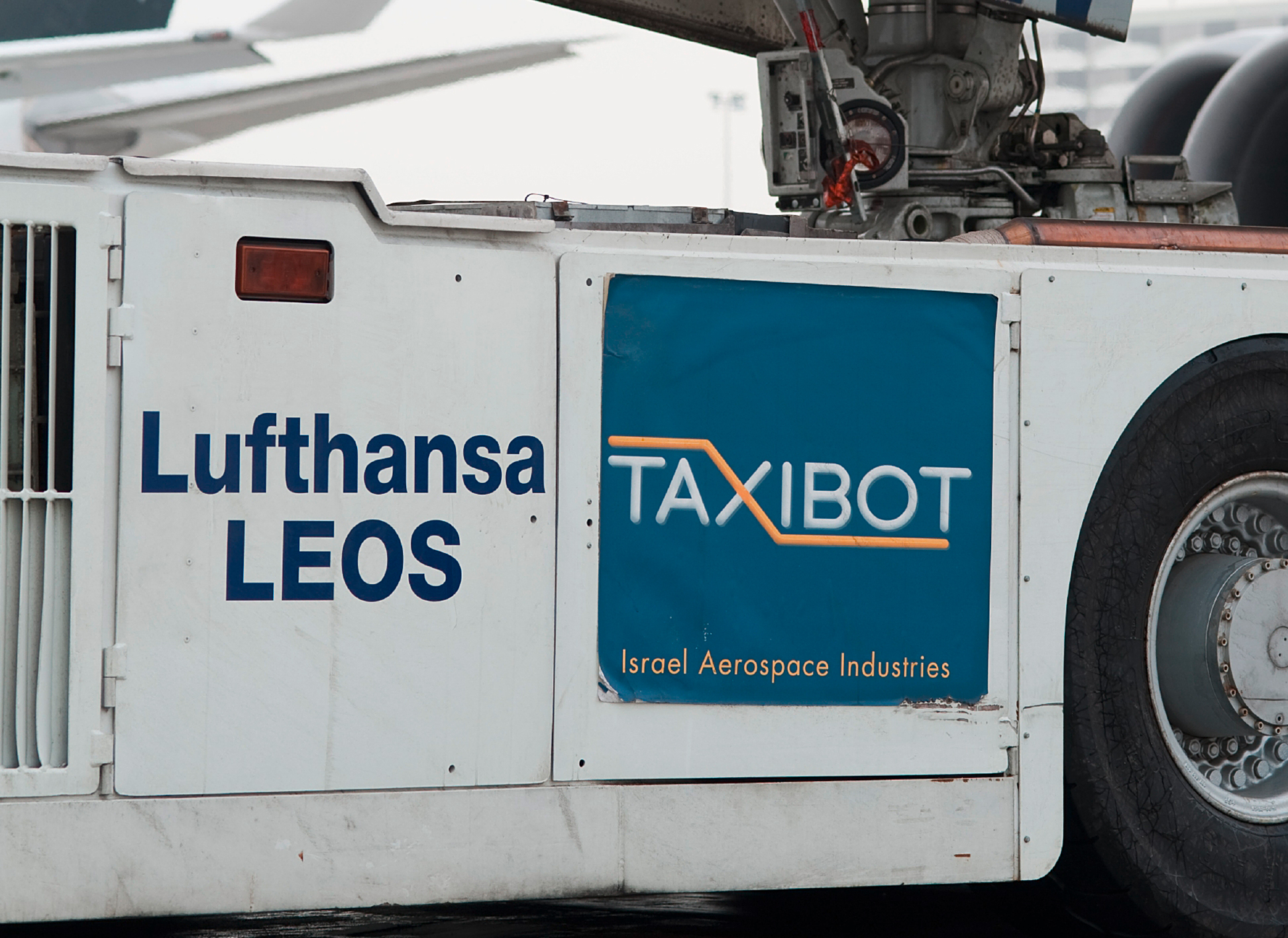 TaxiBot is a tow bar-less aircraft tug with an 800-horsepower diesel-electric drive, used to pull aircraft with their engines off from the gate to the runway.