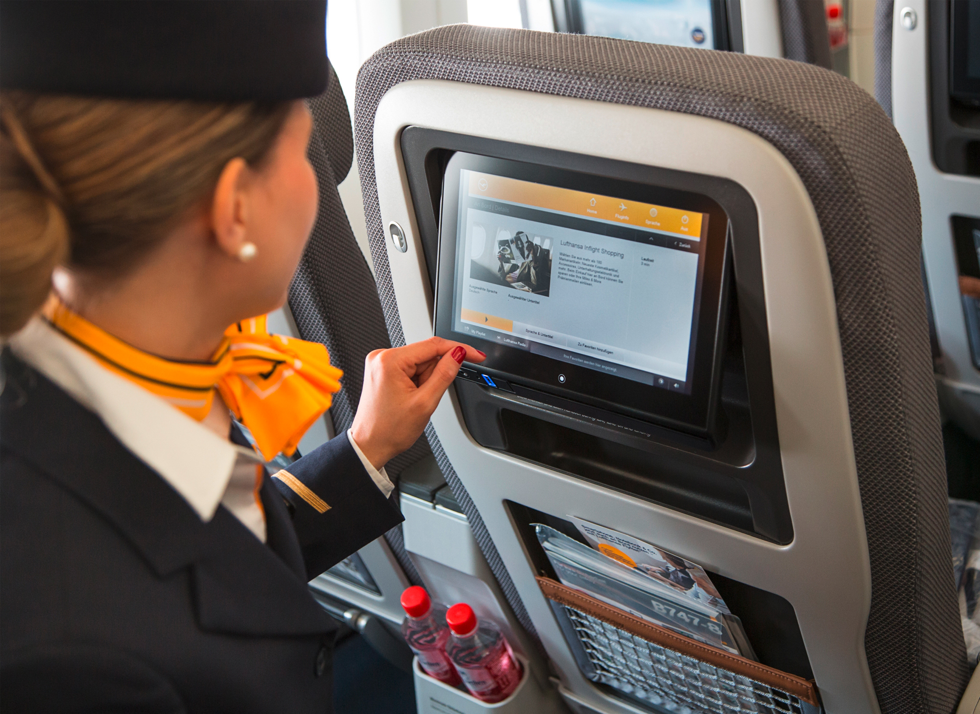Passengers can operate the comprehensive onboard entertainment program from their own touchscreen display in the back of the seat in front.