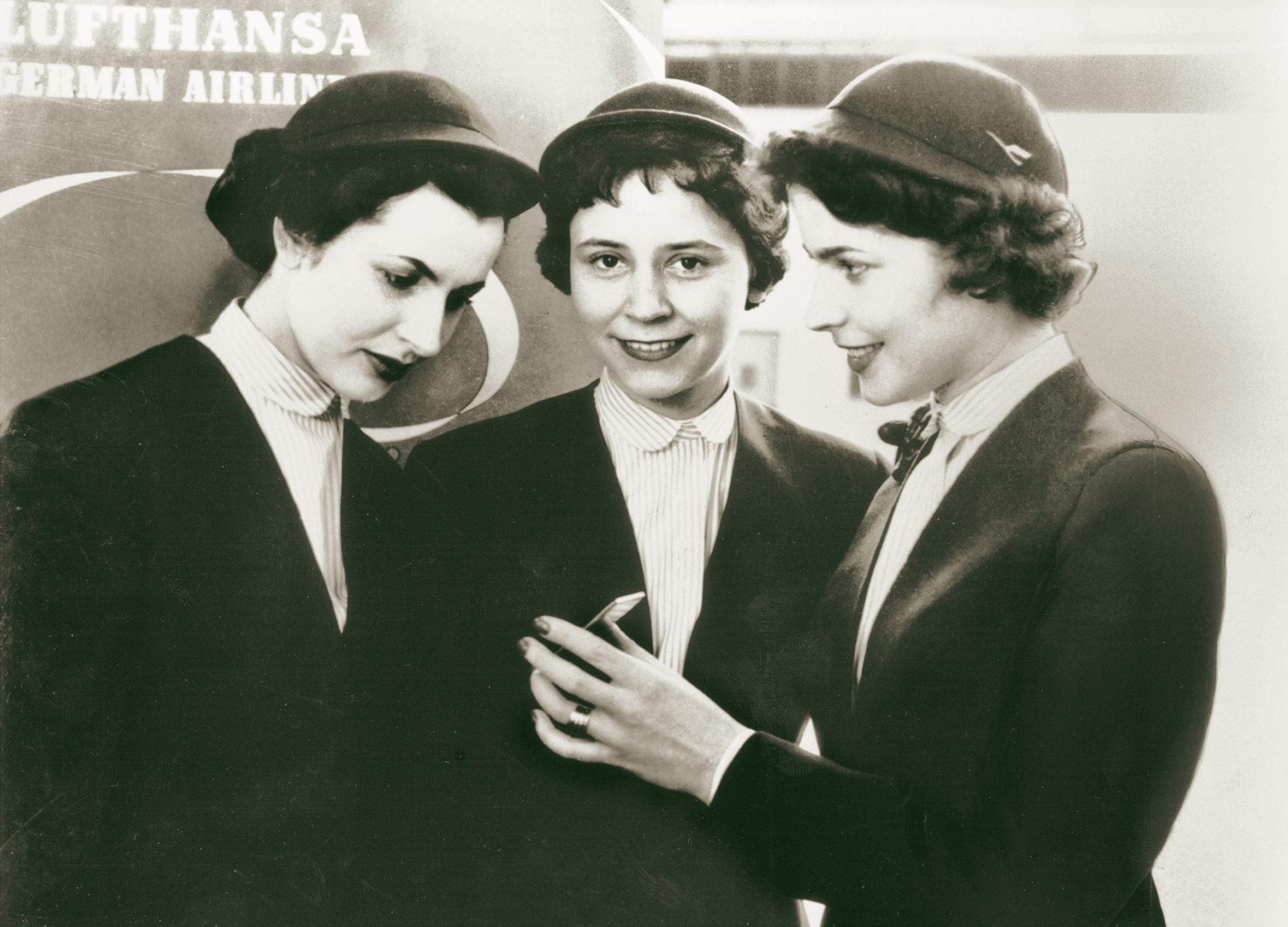 Three women with a “dream job”:  Lufthansa stewardesses in the 1950s.
