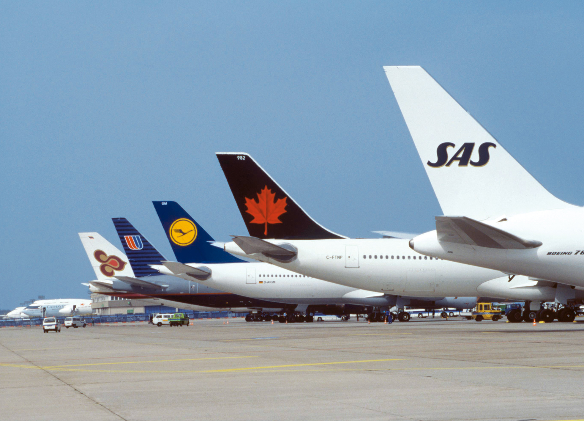 Global reach with support from strong partners:  tails of aircraft operated by the five airlines that founded  the Star Alliance. der Star Alliance.