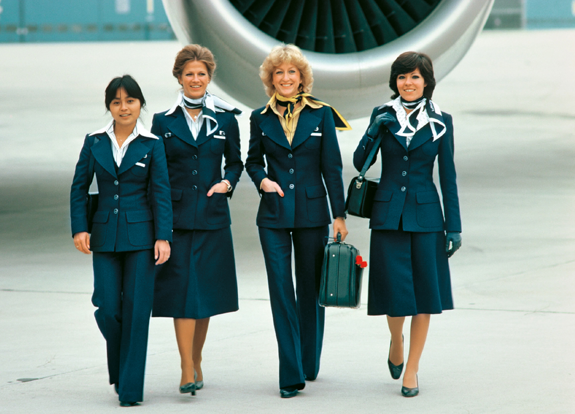 Getting ready for departure: Lufthansa  stewardesses on their way to the aircraft.