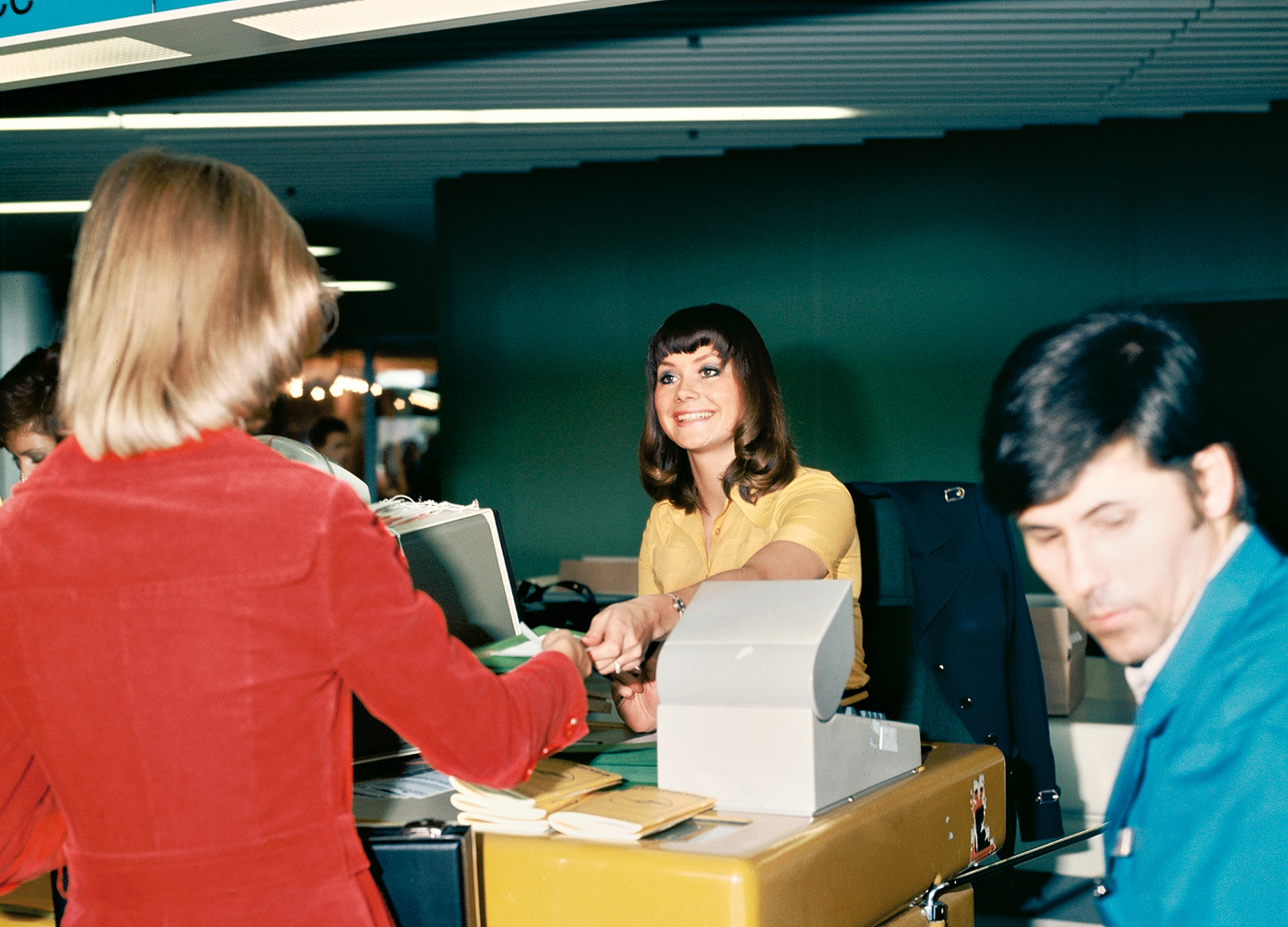 Customer service: a member of Lufthansa's ground staff at a counter.